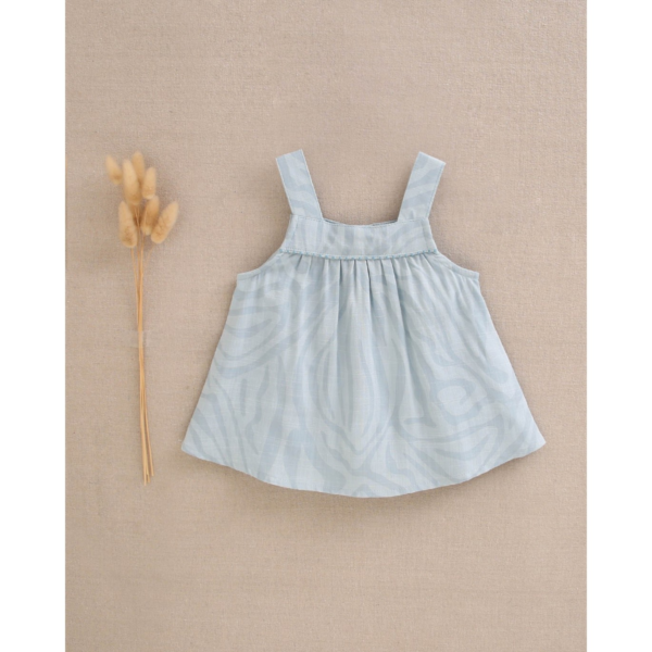 Blusa de bebé niña azul con líneas fluidas