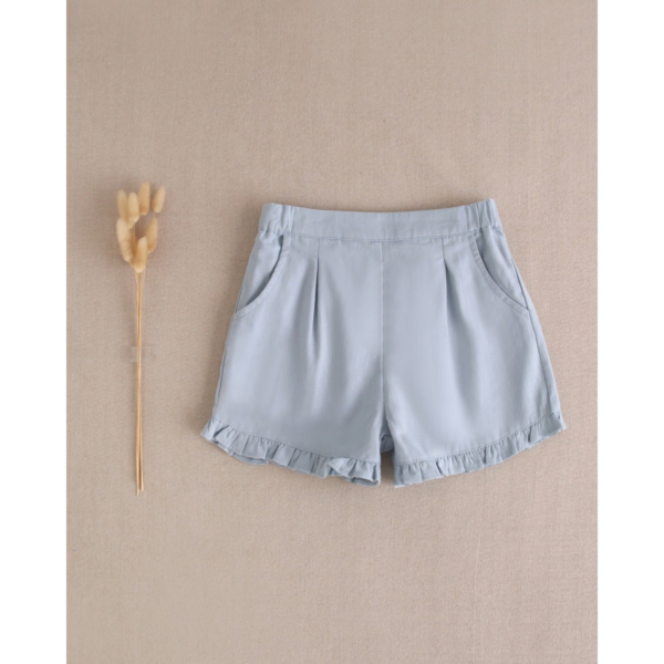 Short de niña azul con volantes en bajo